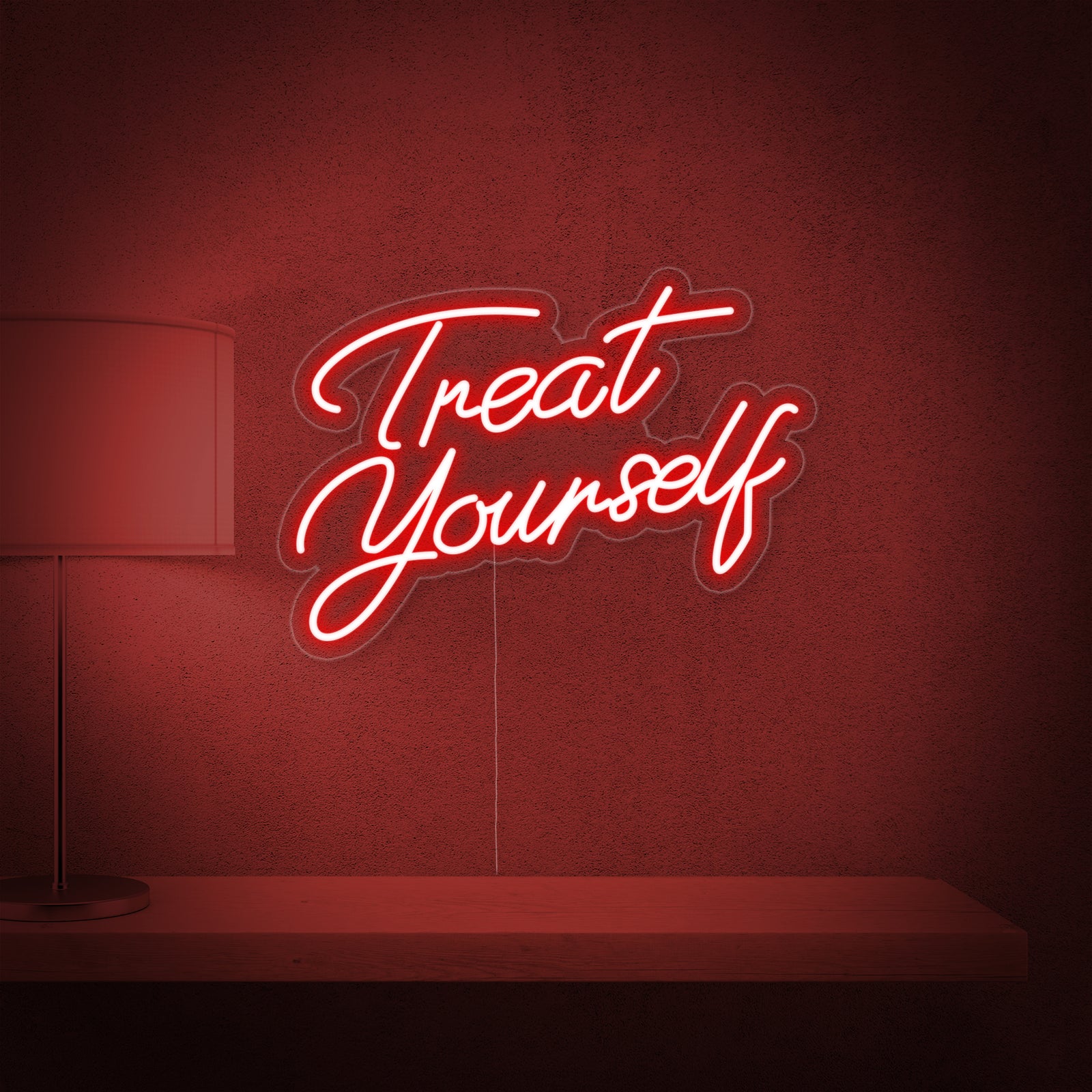 The 'Treat Yourself' neon sign design against a plain background, showing the script font on a clear backing.