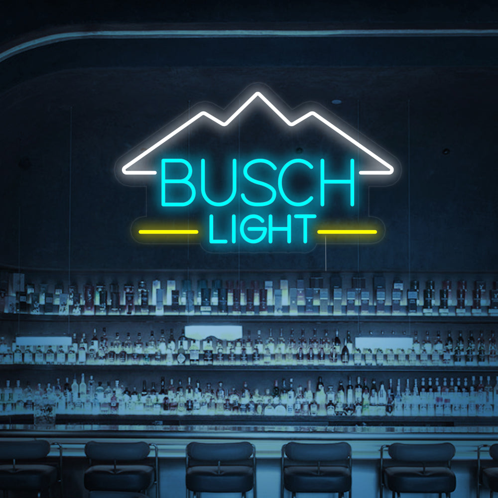 A Busch Light neon sign glowing with a bright blue and white light, mounted on a rustic wooden bar wall.