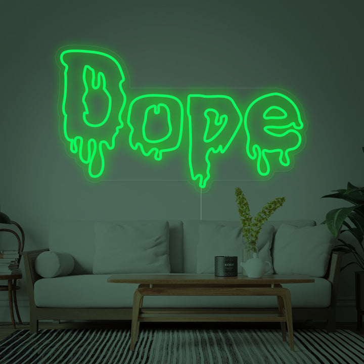 Idealized mockup photo of the "Dope" cannabis neon sign glowing brightly on a textured grey concrete wall, showcasing its stylized script and leaf design for interior decor inspiration.
