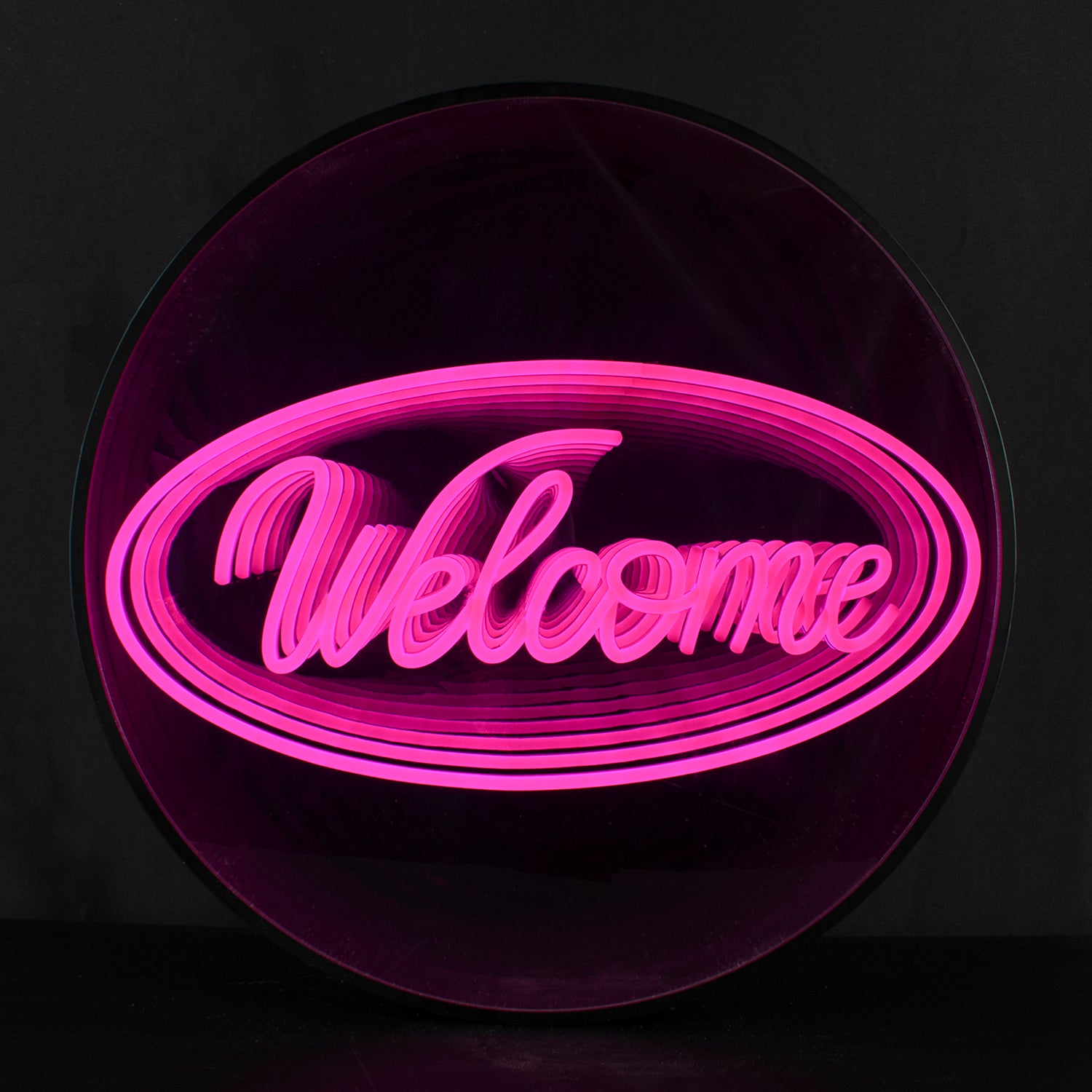 A stunning circular 'Welcome' 3D infinity neon sign illuminated on a black wall, showing a captivating tunnel-of-light effect.