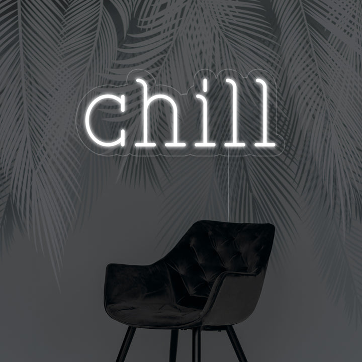 A bright, clear shot of a green 'Chill' neon wall sign mounted on its acrylic backing, showcasing its cool light in an interior setting.