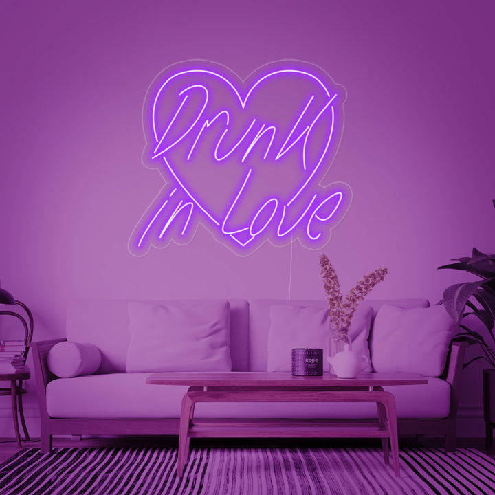 A 'Drunk In Love' neon sign glowing brightly in a modern living space.