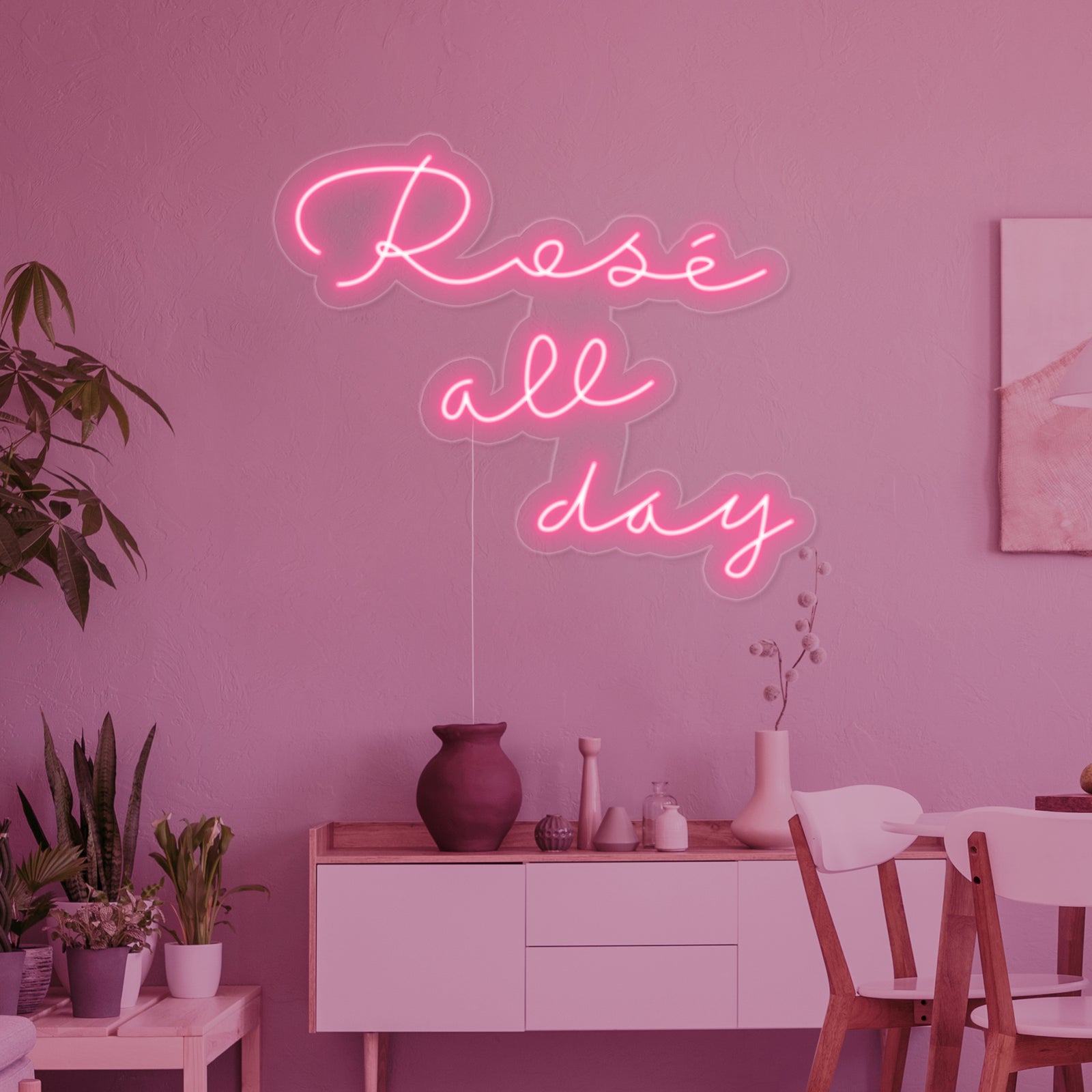 Close-up detail of the "Rose All Day" neon sign showing the clear acrylic backing.