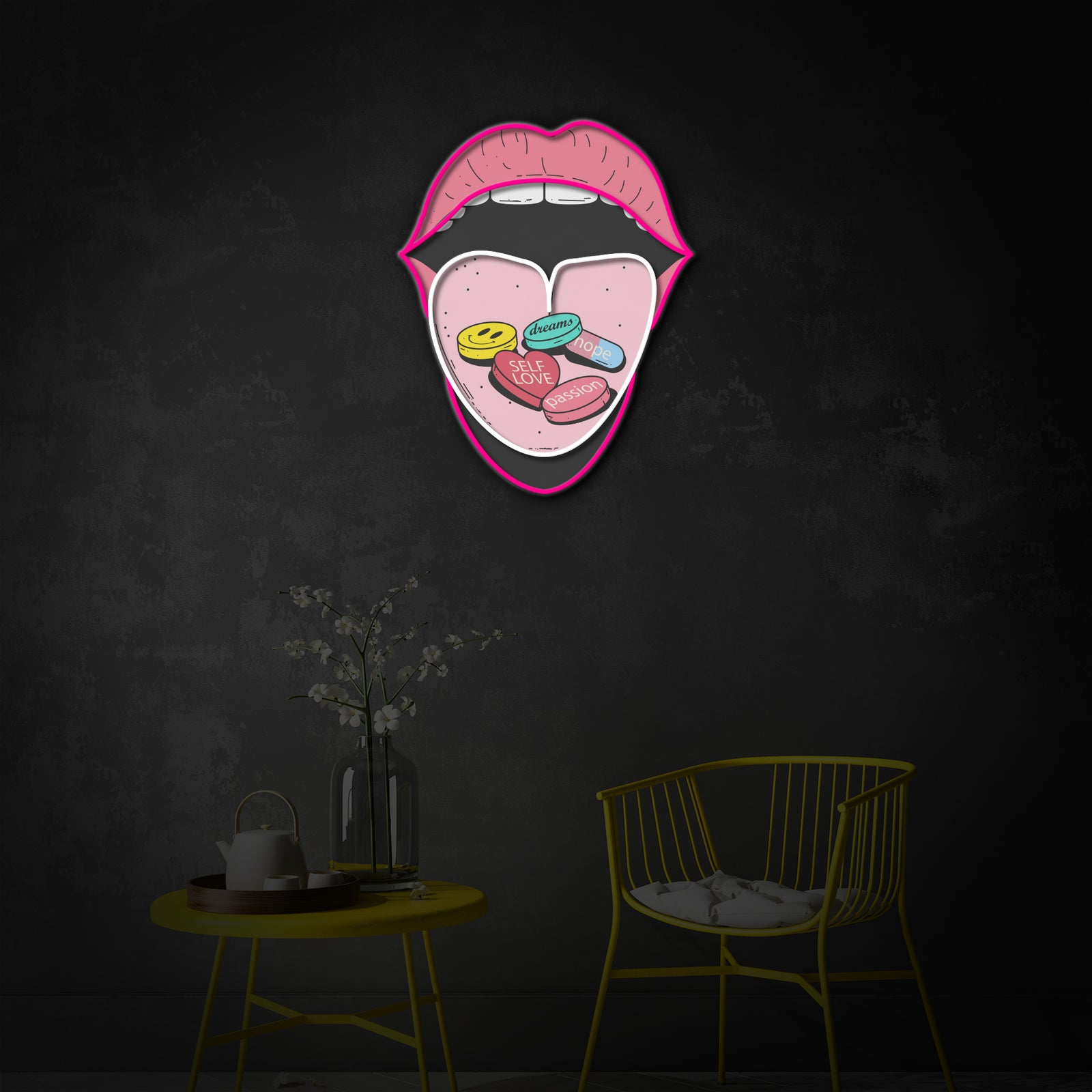 A detailed view of the vibrant 'Self Love Pills Metaphor' neon sign, showing the combination of glowing tubing and printed design against a plain background.