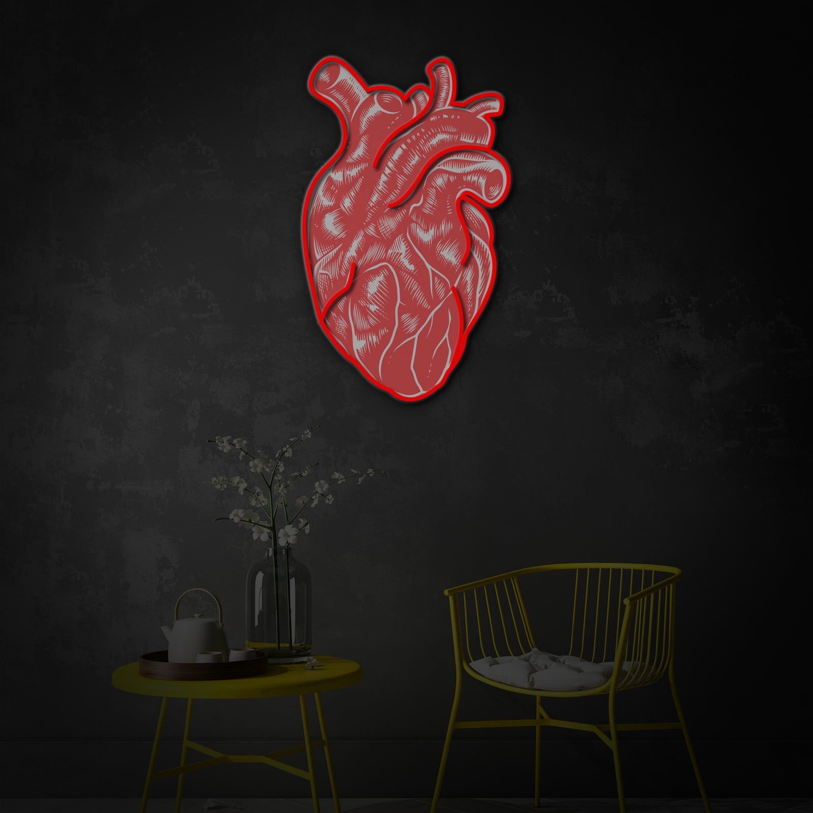 Detailed view of the illuminated Vintage Anatomical Heart neon wall decor mounted above a desk with plants in a modern interior.